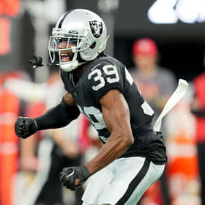 Intense Football Player Celebration Wallpaper