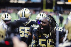 Intense Football Player Motivating Team Wallpaper