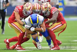 Intense Football Tackle Action Wallpaper