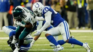 Intense Football Tackle Action Wallpaper