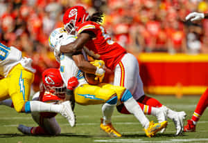 Intense Football Tackle Action Wallpaper