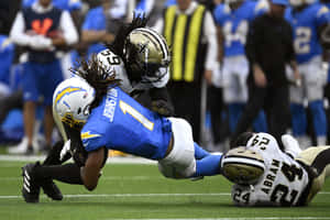 Intense Football Tackle Moment Wallpaper