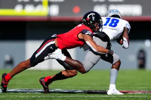 Intense Football Tackle Moment Wallpaper