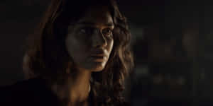 Intense_ Gaze_in_ Shadowy_ Room.jpg Wallpaper