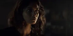 Intense_ Gaze_in_ Shadowy_ Room.jpg Wallpaper