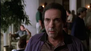 Intense Gaze Man Indoor Scene Wallpaper