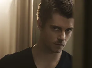 Intense Gaze Man Portrait Wallpaper