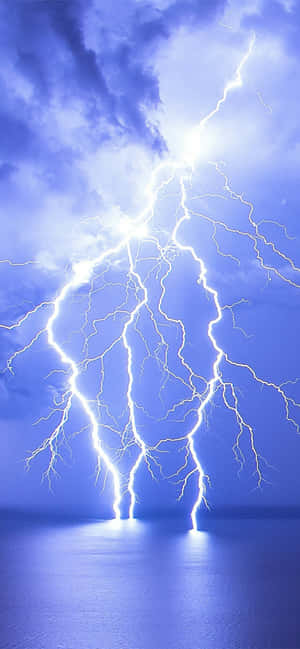 Intense Lightning Strike Over Ocean.jpg Wallpaper