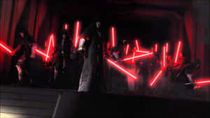 Intense Lightsaber Battle Between Iconic Characters Wallpaper