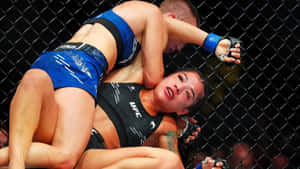Intense M M A Fight Moment Wallpaper