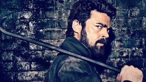 Intense Man Against Brick Wall Wallpaper