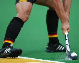 Intense Moment In A Field Hockey Game Wallpaper