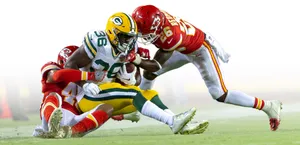 Intense Moment Of Football Tackle Wallpaper