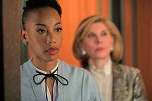 Intense Office Scenewith Two Women Wallpaper