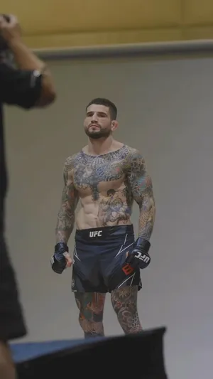 Intense Photoshoot Moment With Sean Brady Wallpaper