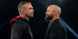 Intense Staredown Wrestling Ring Wallpaper