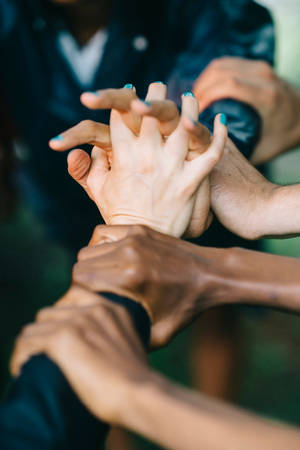 Intertwined Hands In Sierra Leone Wallpaper