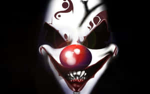 Intimidating Clown Facein Darkness Wallpaper