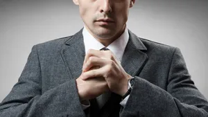 Intimidating Man In Suit Wallpaper