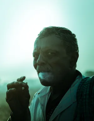 Intimidating Smoking Man Wallpaper