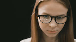 Intimidating Woman With Eyeglasses Wallpaper