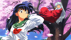 Inuyasha And Kagome Embracing Each Other In A Magical Forest Wallpaper