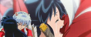 Inuyasha And Kagome Share A Heartfelt Moment In Their Magical Adventure Wallpaper