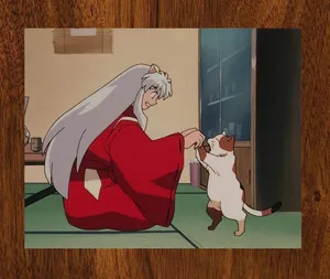 Inuyasha Shields Rin During A Mystical Adventure Wallpaper