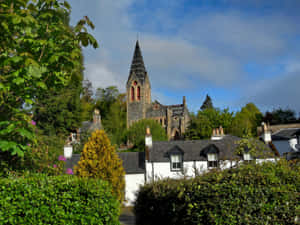 Inverness Church Behind Homes Wallpaper