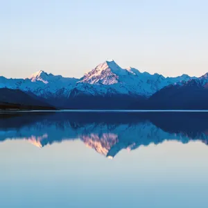 Ipad Pro Snowy Mountain Near Lake Wallpaper