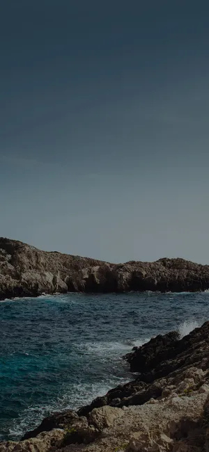 Iphone X Beach And Rock Cliffs Wallpaper