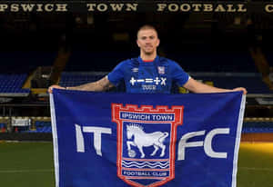 Ipswich Town F.c. Players Celebrating On The Field Wallpaper