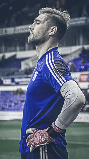 Ipswich Town Football Club On The Pitch At Sunset Wallpaper