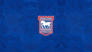 Ipswich Town Football Club Players Celebrating On The Field Wallpaper