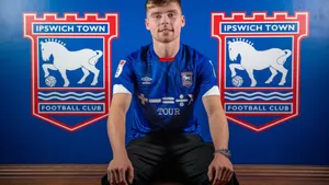 Ipswich Town Football Club Players Celebrating On The Field Wallpaper