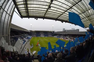 Ipswich Town Football Club Players Celebrating On The Pitch Wallpaper