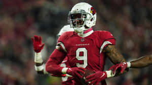 Isaiah Simmons Arizona Cardinals Action Shot Wallpaper