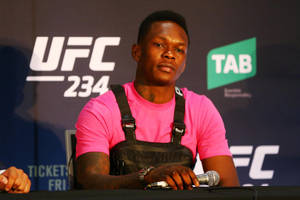 Israel Adesanya In Press Conference Wallpaper