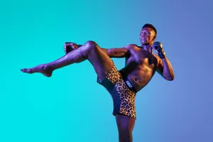 Israel Adesanya Kick Pose Wallpaper