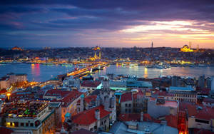 Istanbul Skyline At Night Over The Bosphorus Wallpaper