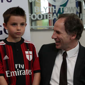 Italian Football Legend Franco Baresi Posing With A Young Fan Wallpaper