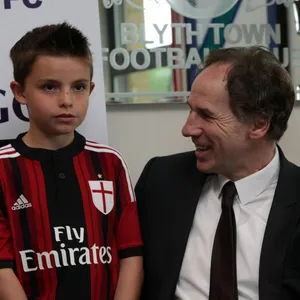 Italian Football Legend Franco Baresi Posing With A Young Fan Wallpaper