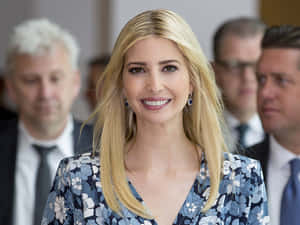 Ivana Trump Delightfully Interacting With A Group Of Men Wallpaper