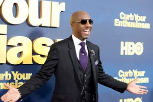 J.b. Smoove Looks Gleefully At A Camera Wallpaper