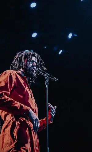 J Cole Performing Onstage Wallpaper
