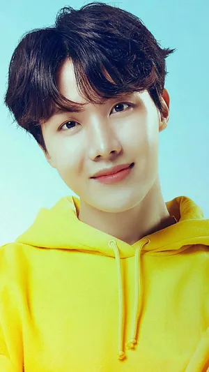 J-hope Donning A Yellow Hoodie Wallpaper