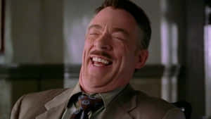 J. Jonah Jameson Intently Focused At His Desk Wallpaper