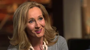 J.k. Rowling Smiling At A Book Event Wallpaper