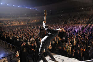 J-rock Band Members Performing Live Onstage Wallpaper