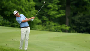 J.t. Poston Showcasing His Skills On The Golf Course Wallpaper